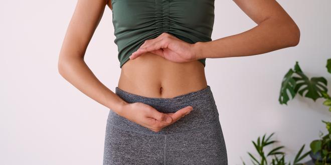 a healthy woman with a balanced gut
